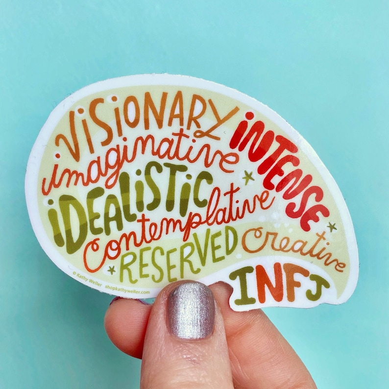 May include: A white sticker with a light green, orange, and red color scheme. The sticker is shaped like a brain and features the words "Visionary", "Imaginative", "Idealistic", "Intense", "Contemplative", "Reserved", "Creative", and "INFJ".