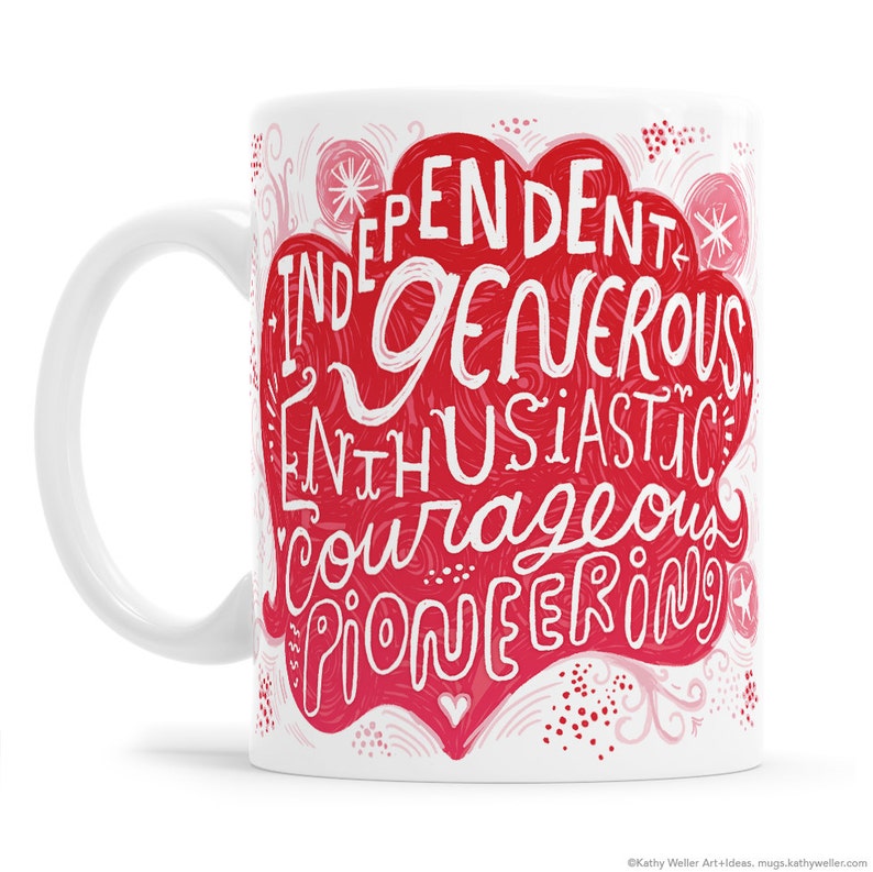 May include: White ceramic mug with a red heart-shaped design. The heart features white text that reads "Independent, Generous, Enthusiastic, Courageous, Pioneering".