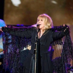 Stevie Nicks in concert wearing the black with silver shawl by Crickets Knits