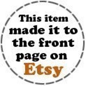 May include: A black and white graphic with the text "This item made it to the front page on Etsy" in a circle with a dashed border.