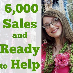 May include: A woman with long brown hair wearing a pink shirt and a green crocheted scarf with a pink flower. The text "6,000 Sales and Ready to Help" is in green letters on a white background.