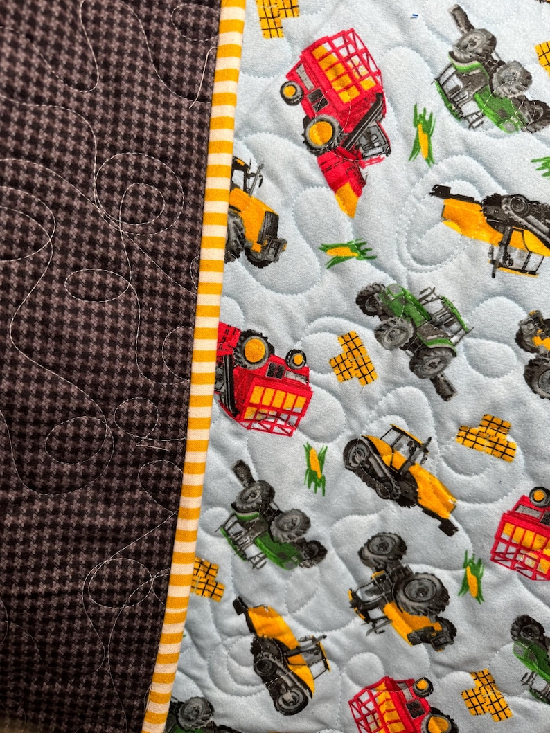 Tractor farm theme soft flannel reversible toddler/child/crib/lap quilt. Handmade quilted blanket, heirloom quality, and a perfect gift!
