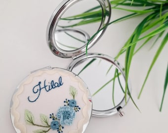 Embroidered hand mirror