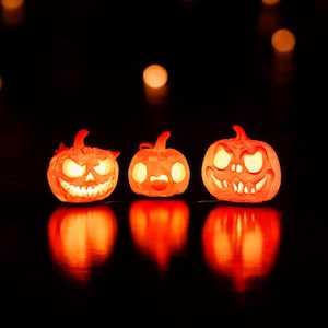 Zestaw 3 dekoracyjnych świeczek typu tealight w kształcie dyni na Halloween - Dekoracja Jack-o'-Lanterns