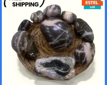 Set of decorative sea stones coated with epoxy resin in a wicker bowl Eco-friendly craft Natural sea stones for various crafts kitchen decor