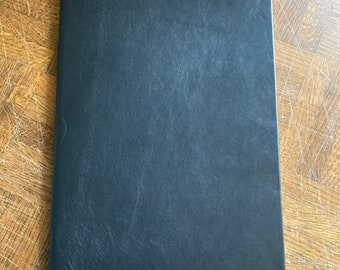 A4:  Softcover Black leather bound A4 sized lined notebook