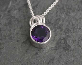 Amethyst Pendant: Faceted 8mm Gemstone, Sterling Silver Setting