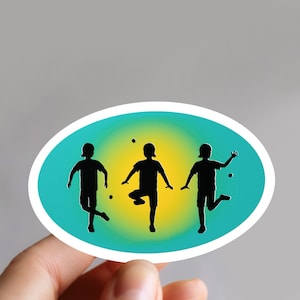 May include: A sticker featuring three silhouettes of people juggling balls against a blue and yellow gradient background.