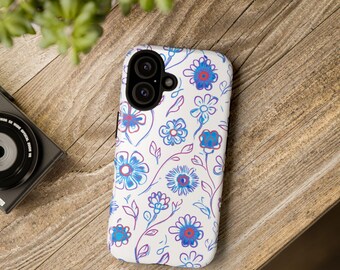 May include: A white phone case with a blue and red floral pattern. The case has a cutout for the camera lens.