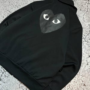 May include: A rustic wooden sign with the text "Welcome to our home" in white lettering. The sign features a distressed finish and a simple, inviting design, perfect for a front porch or entryway.