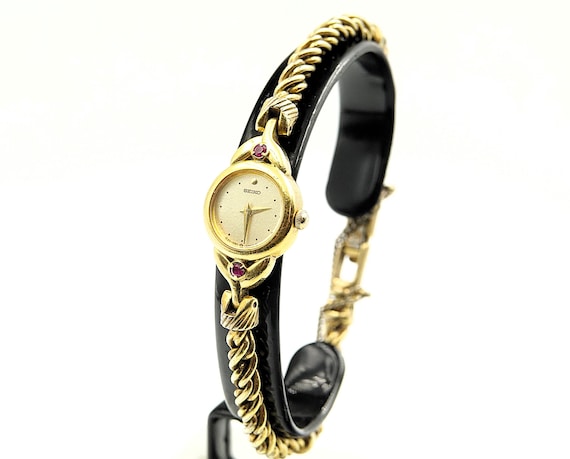 Seiko Watches Ladies Gold tone with 2 rubies Dress Cocktail Watch Ref. 1E20-0430 - Vintage 1989's
