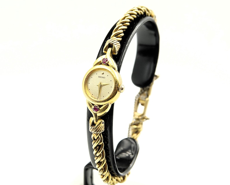 Relojes Seiko para mujer en tono dorado con 2 rubíes, reloj de cóctel de vestir Ref. 1E20-0430 - Vintage 1989 imagen 1
