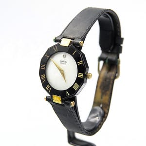 Hermoso reloj vintage IAXA COCKTAIL de dos tonos, oro, titanio, negro y nácar con un DIAMANTE real. Original, fabricado en Suiza, para correr, de cuarzo.