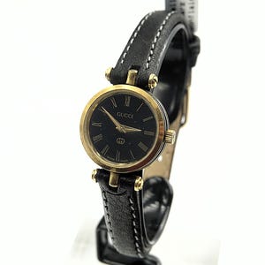 Authentic Vintage Gold Gucci Black watch leather band Roman Numeral Gucci Logo Vintage Gucci 2200L Swiss Watch Roman Numerals Mineral  main image 3