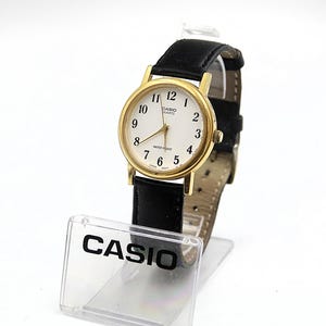 Beautiful CASIO Gold Tone White Dial Dress Watch Mens Watch Ref. 1330 MTP-1095 Quartz Watch