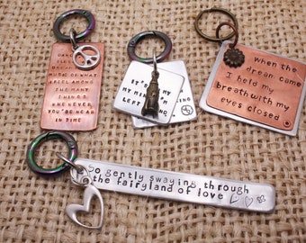 Hand-stamped copper and aluminum key chain / fairyland of love / When the dream came / It's on my mind I'm left behind / Dance sing sleep