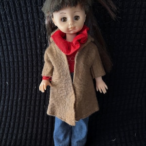 1981/82 Vogue sleepy eye Ginny, Vidal Sassoon clothing.  Red labeled top, blue jeans and brown felt coat. Nice used condition. See pics