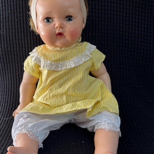 1950s/60s American Character “Tiny Tears w Rock-a-Bye Eyes.” 15”  sleepy-eye vinyl doll.  Poseable head, arms + legs. Replacement clothes.