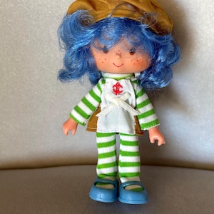 Muñeca vintage de Tarta de Fresa "Crepe Suzette" de 1982 - Kenner American Greetings. Lea a continuación.