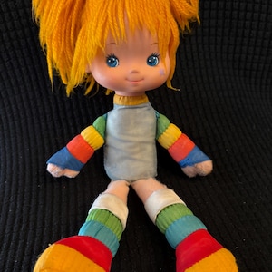 1983 Rainbow Brite 11” Doll. Plastic Head, soft body. Hallmark/Mattel. Missing dress/fade to body and tag. See pics.