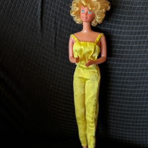1978 Superstar Era  “Pretty Changes Barbie”  #2598. Short curly blonde hair with original yellow pant suit. VGUC with some issues. Read/see