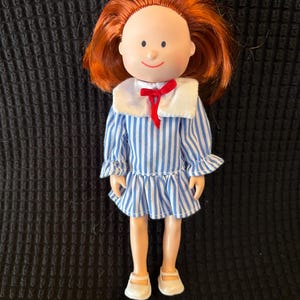 1994 Madeline wearing RARE sailor dress #33365, with white underwear and white Mary Jane shoes. Eden Toys. Doll and clothing in EUC.