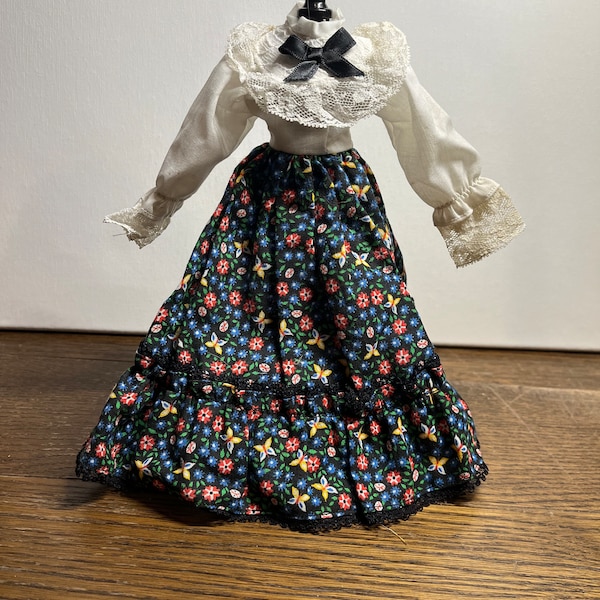 Barbie-sized Prairie/Pioneer/western dress, long-sleeved, black floral w/ yellow butterflies & red/blue flowers, lace top, unknown year