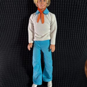 2002 “Ken as Fred” Cartoon Doll with Rooted Hair and original pants and top. #83284. Replacement shoes. Read below for further details.