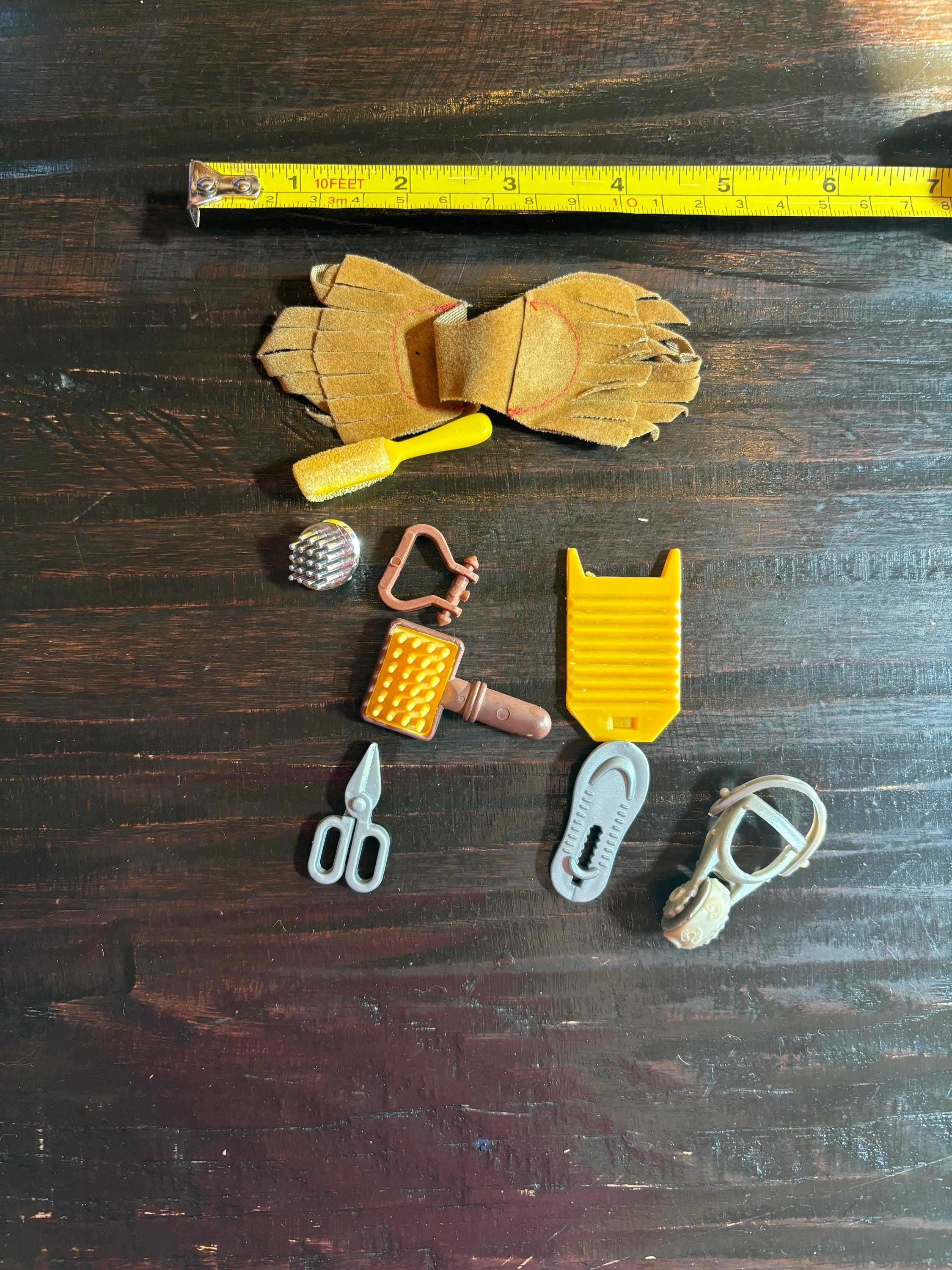 Barbie-size horse grooming accessories. As pictured.