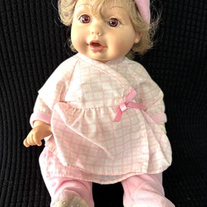 1995 Playmates “Baby So Beautiful” Newborn Baby Girl 12” Doll Ash Blonde hair. BSB tagged diaper, hat, 2-piece pjs, wristband & bottle.