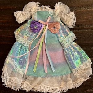 Lady Lovely Locks Dress for “Maiden Fairhair.”  Mattel 1986. Blue, pink, white irridescent dress w white lace trim. W comb. See pics. EUC.