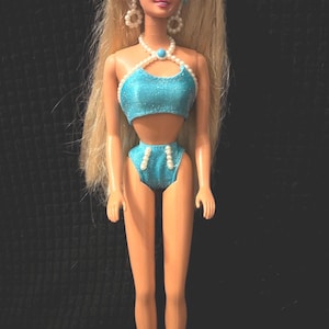 Pearl Beach 1997 Mattel #18576. With swimsuit & earrings. In EUC.