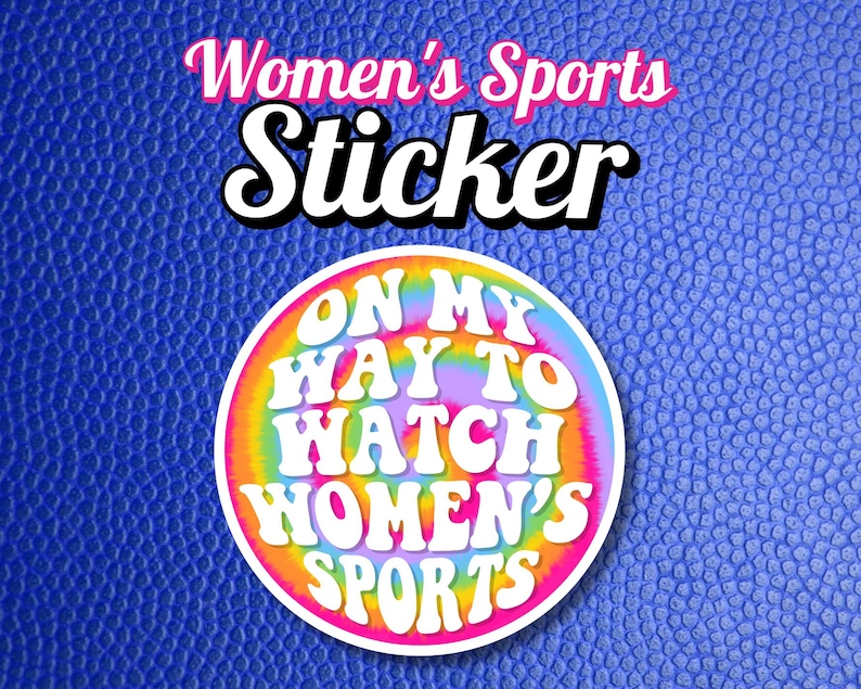 May include: A round sticker with a tie-dye background and the text "On My Way To Watch Women's Sports" in white letters.