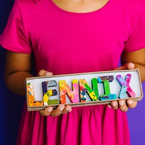 Each rainbow crayon letter is easy to hold and features an array of bright colors, which blend together in endless combinations as you create your masterpiece. Art2theExtreme name crayons come ready-to-gift and are a unique birthday gift for kids.