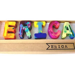 Personalized crayon names featuring Multi-colored crayons in ABC shapes. Crayon shop, Art 2 the Extreme, creates custom crayons in any name! Each crayon letter is easy to hold and features an array of bright colors that blend together.