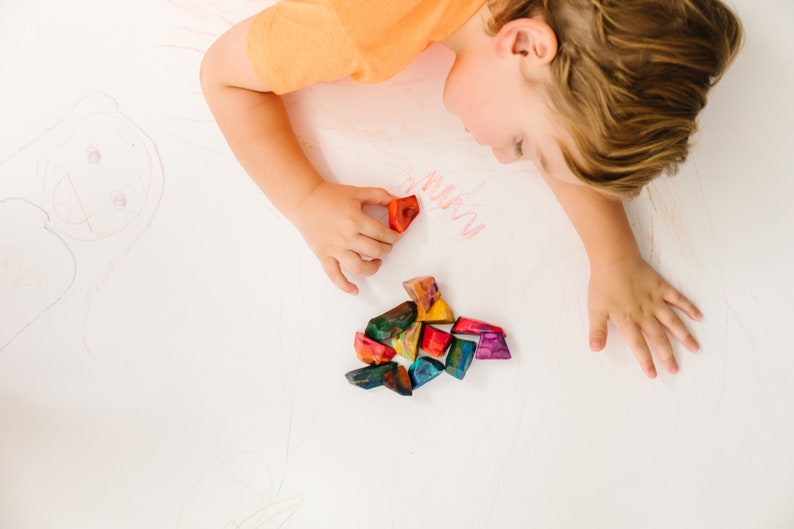 Rainbow crayon rocks by crayon shop Art2theExtreme are easy to hold and features an array of bright colors, which blend together in endless combinations as you create your masterpiece.