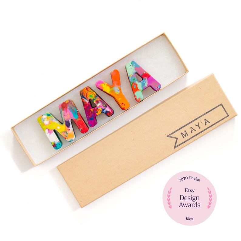 Rainbow Crayon letter name set in gift box, Personalized crayon names from Art 2 the Extreme on Etsy. Colorful crayon craft supplies in abc letter shapes that spell the recipient's name.