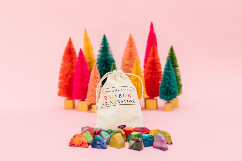 Rainbow crayon rocks by crayon shop Art2theExtreme are easy to hold and features an array of bright colors, which blend together in endless combinations as you create your masterpiece.