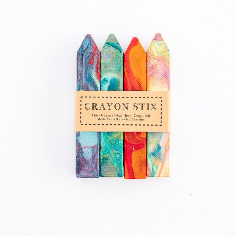 May include: Four colorful crayon stix, made from recycled crayons, with a label that reads "Crayon Stix The Original Rainbow Crayon&reg; Made from Recycled Crayons".