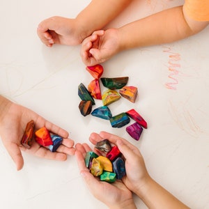 Rainbow crayon rocks by crayon shop Art2theExtreme are easy to hold and features an array of bright colors, which blend together in endless combinations as you create your masterpiece.