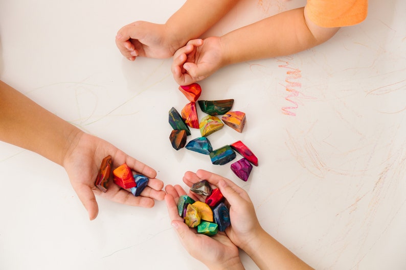 Rainbow crayon rocks by crayon shop Art2theExtreme are easy to hold and features an array of bright colors, which blend together in endless combinations as you create your masterpiece.