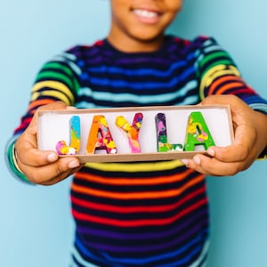 Personalize crayon gift for kid. This name crayon set comes in a rainbow of colors and is perfect for a 2 year old gift! This crayon set comes ready to gift in a personalized crayon box.