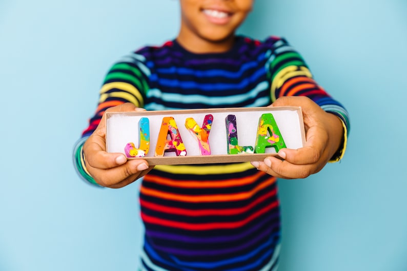Personalize crayon gift for kid. This name crayon set comes in a rainbow of colors and is perfect for a 2 year old gift! This crayon set comes ready to gift in a personalized crayon box.