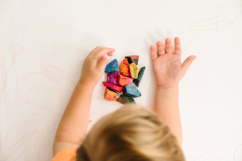 Rainbow crayon rocks by crayon shop Art2theExtreme are easy to hold and features an array of bright colors, which blend together in endless combinations as you create your masterpiece.