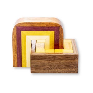 The Golden Pot Wood Puzzle from Pelikan Puzzles is wooden IQ Logic Puzzle, Brain Teaser, Puzzle Master, Burr Puzzle