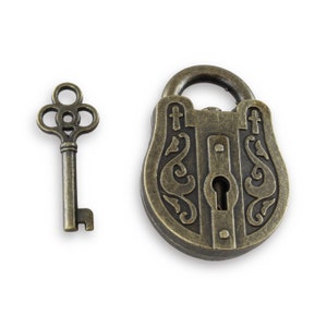 May include: A vintage-style brass padlock with an intricate design and a matching key. The padlock has a decorative keyhole and a curved shape.