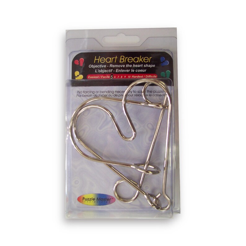 May include: A silver metal heart-shaped puzzle called "Heart Breaker". The objective is to remove the heart shape. The puzzle is packaged in a clear plastic bag with a white and blue label. The label includes the name of the puzzle, the objective, and a difficulty rating scale from 5 to 10.