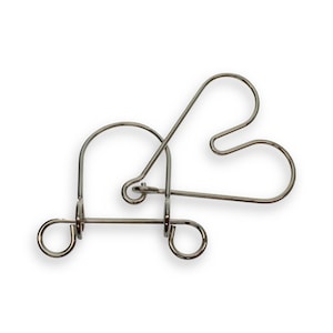 May include: A silver metal puzzle in the shape of a heart. The puzzle is made of several interlocking pieces that can be manipulated to create different shapes.