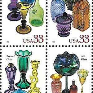 May include: Four US postage stamps featuring different types of glass: Free-blown, Mold-blown, Pressed, and Art. Each stamp depicts a variety of glass objects in different colors and styles. The stamps are all from 1993 and have a value of 33 cents.