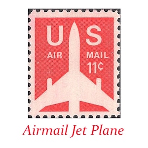 May include: A vintage U.S. Air Mail postage stamp featuring a white jet plane silhouette against a red background. The stamp reads "U.S. AIR MAIL 11¢" in white text. The words "Airmail Jet Plane" are written in red below the stamp.